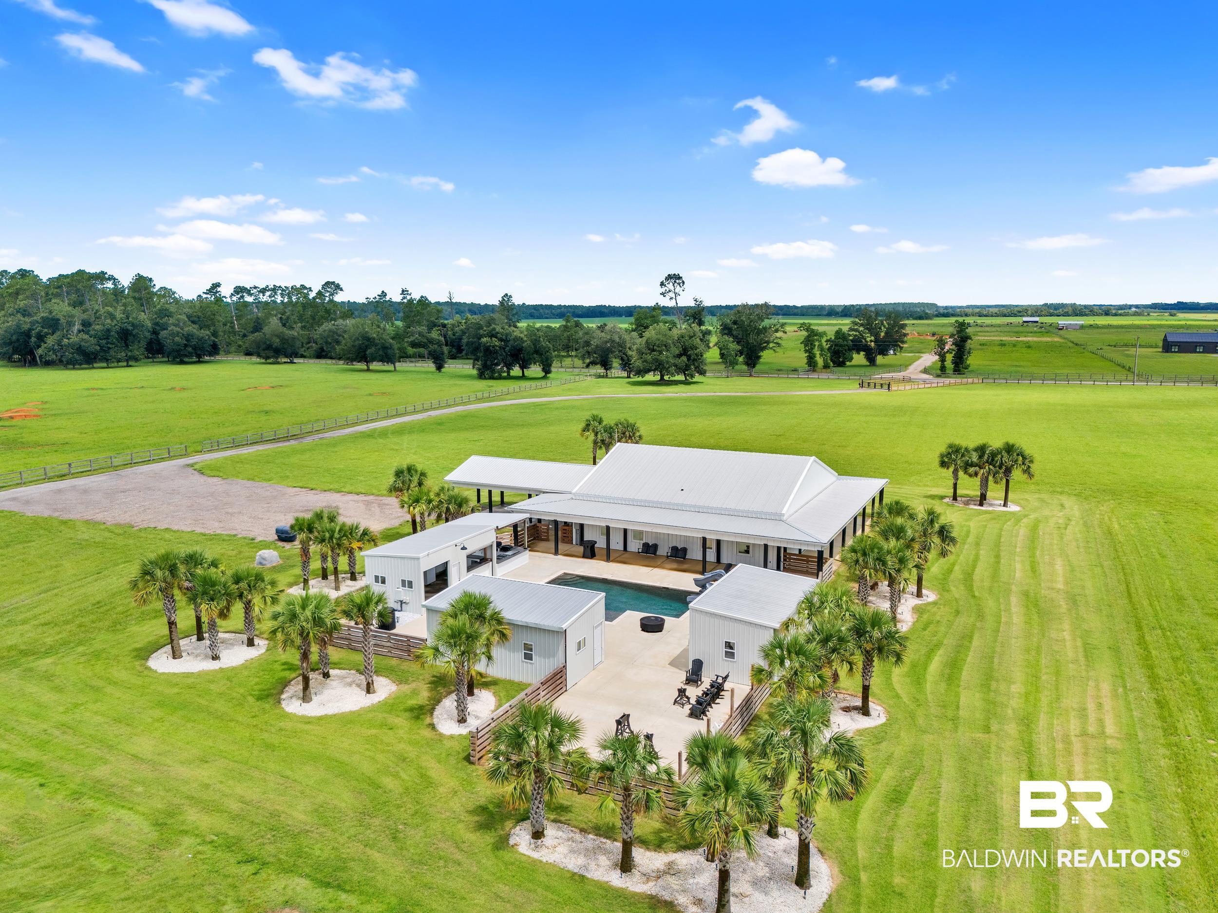 22592 Pastoral Lane Foley, AL 36535 - Photo 38 of 45 Aerial view of sparsely populated area with a tree filled landscape
