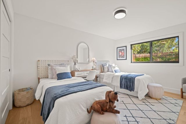 a bedroom with bed and a couch