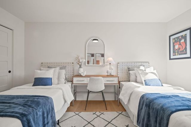 a bedroom with a bed and a couch