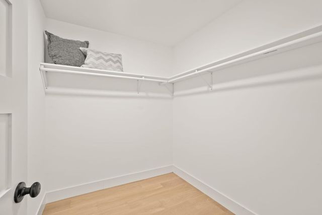 a bathroom with a shower and vanity