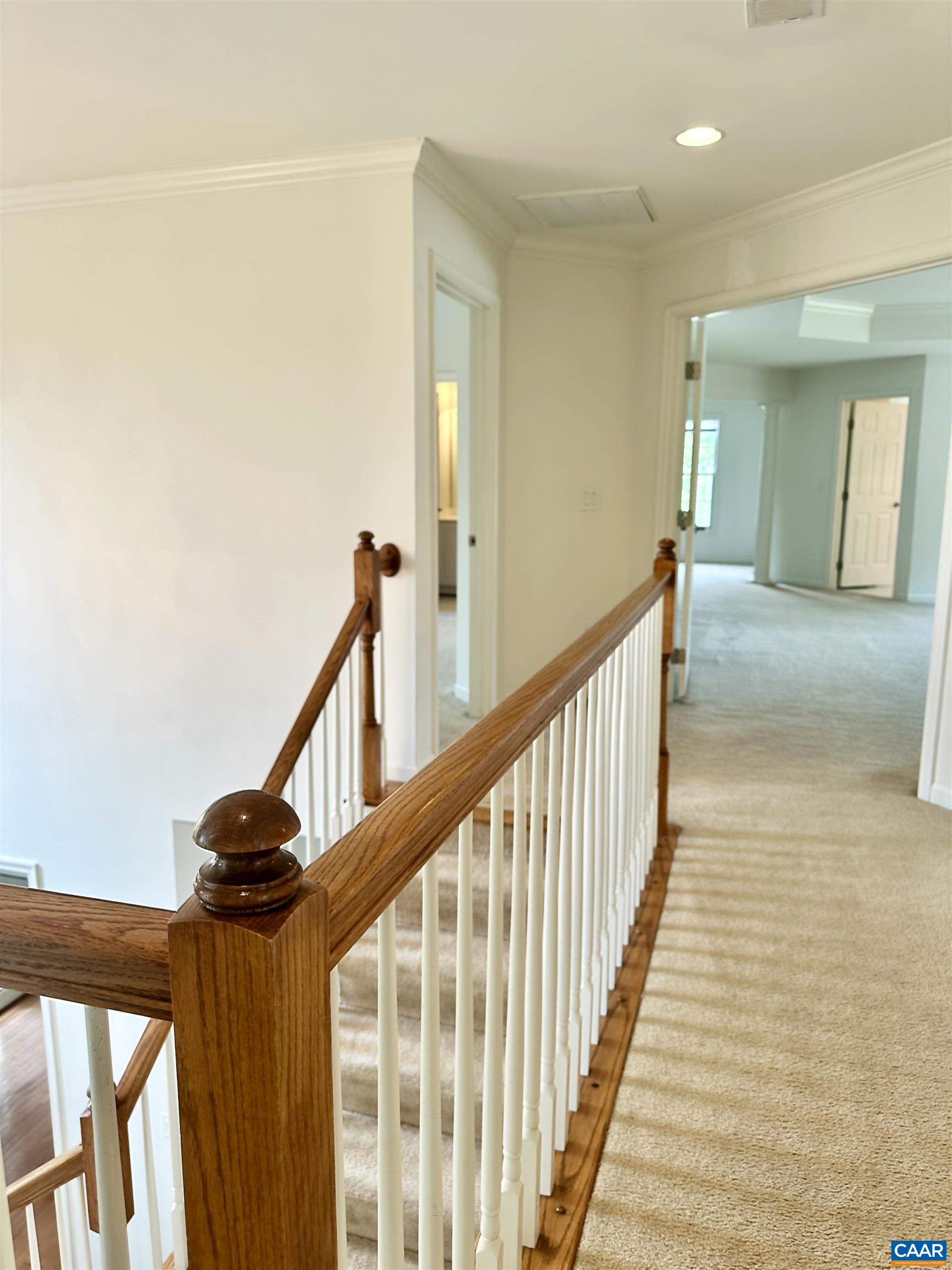 252 Millstream Drive Crozet, VA 22932 - Photo 13 of 41 a view of a hallway with wooden floor and staircase
