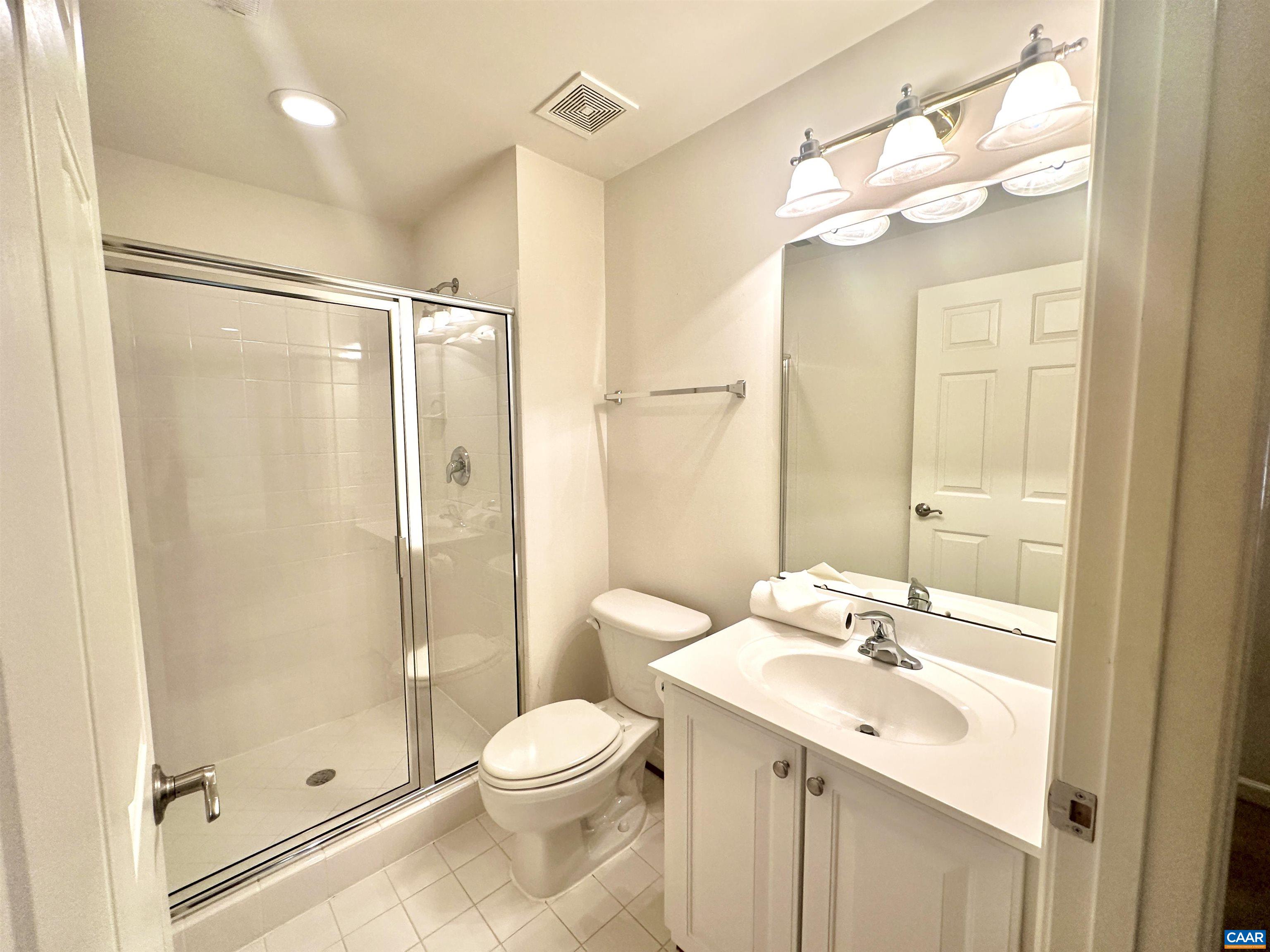 252 Millstream Drive Crozet, VA 22932 - Photo 14 of 41 a bathroom with a sink a toilet and shower