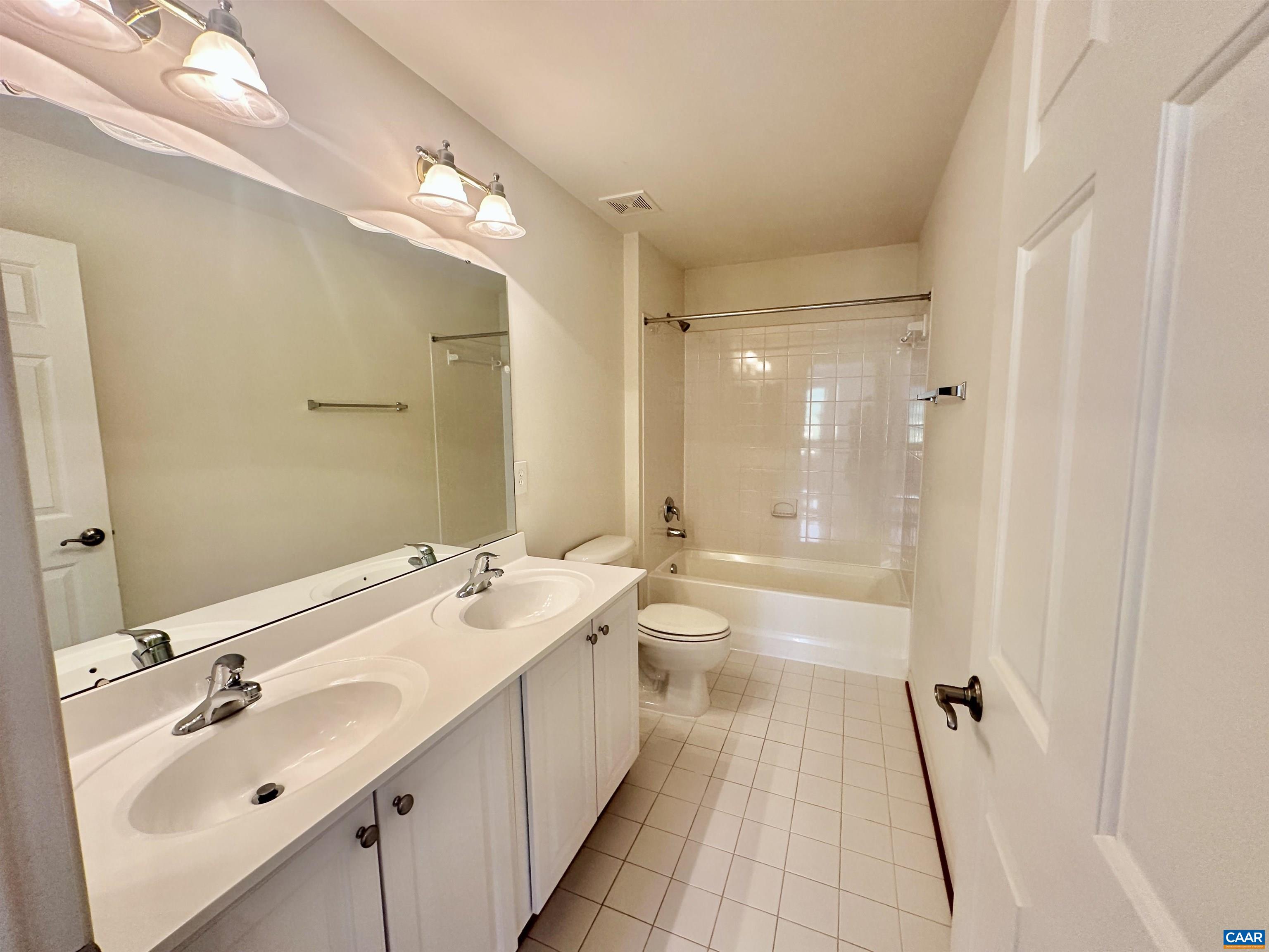 252 Millstream Drive Crozet, VA 22932 - Photo 36 of 41 a bathroom with a double vanity sink mirror double and shower