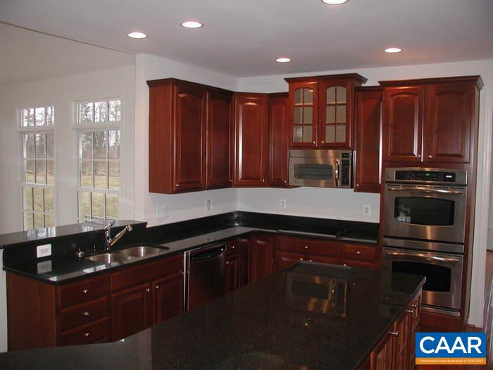252 Millstream Drive Crozet, VA 22932 - Photo 8 of 41 a kitchen with wooden cabinets and a sink