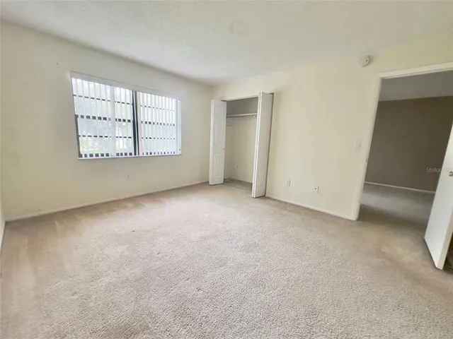 a white bath tub sitting next to a white toilet