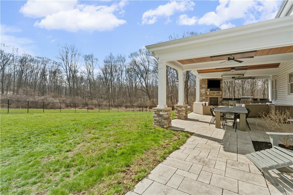 237 Morning Grove Lane Valencia, PA 16059 - Photo 48 of 50 a view of a patio with couches and table and chairs with wooden fence