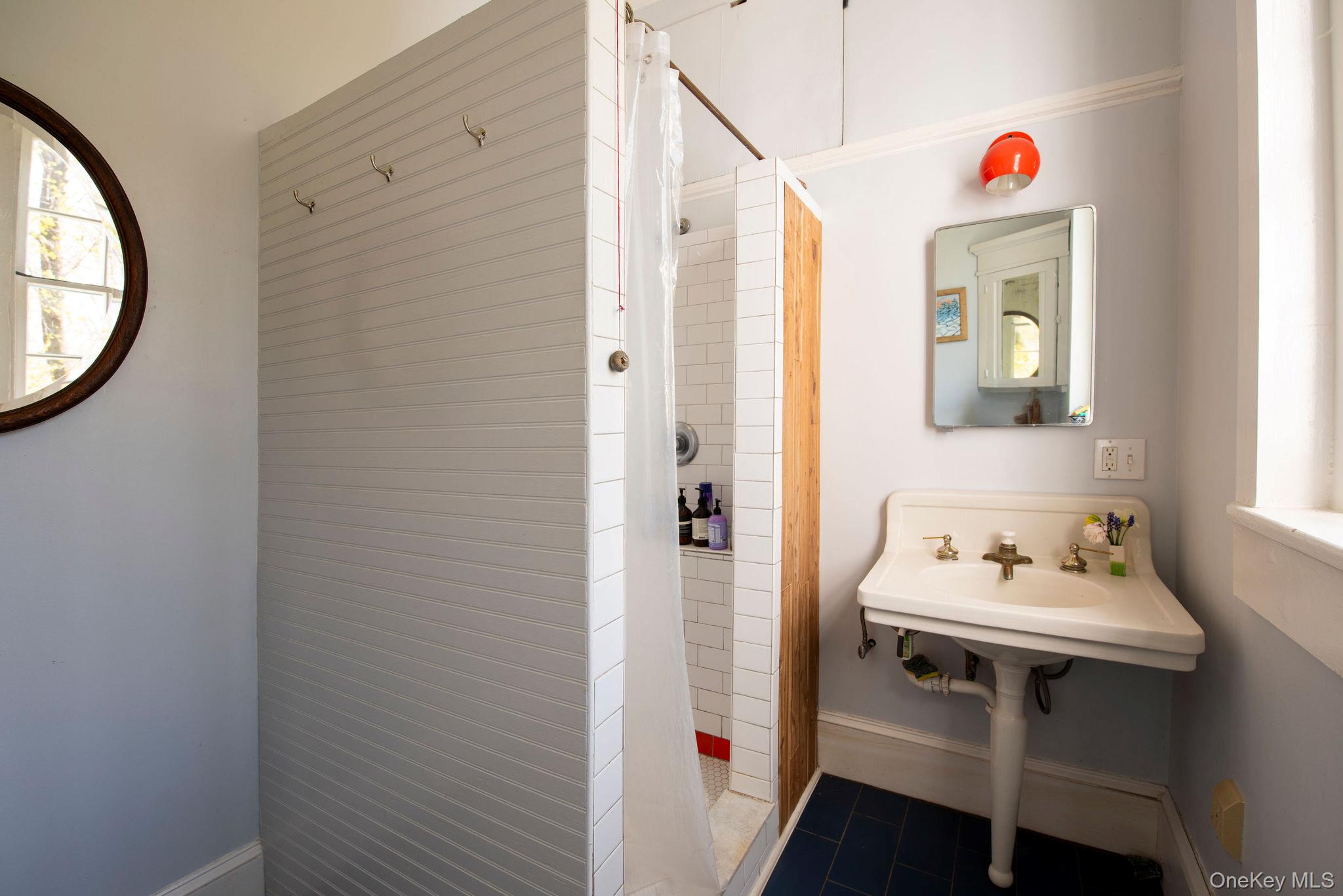 225 Barrytown Road Barrytown, NY 12507 - Photo 12 of 22 a bathroom with a sink and a mirror