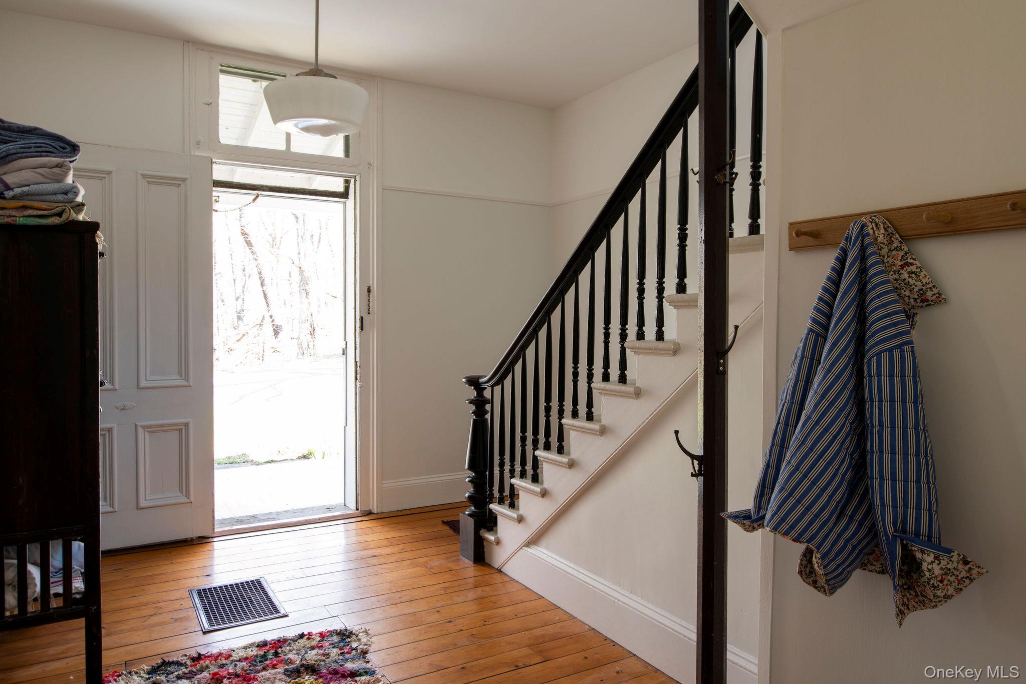 225 Barrytown Road Barrytown, NY 12507 - Photo 13 of 22 a view of hallway with wooden floor and stairs