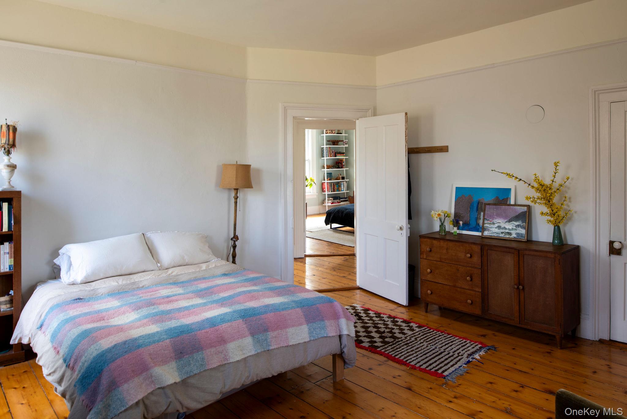 225 Barrytown Road Barrytown, NY 12507 - Photo 16 of 22 a bedroom with a bed and wooden floor