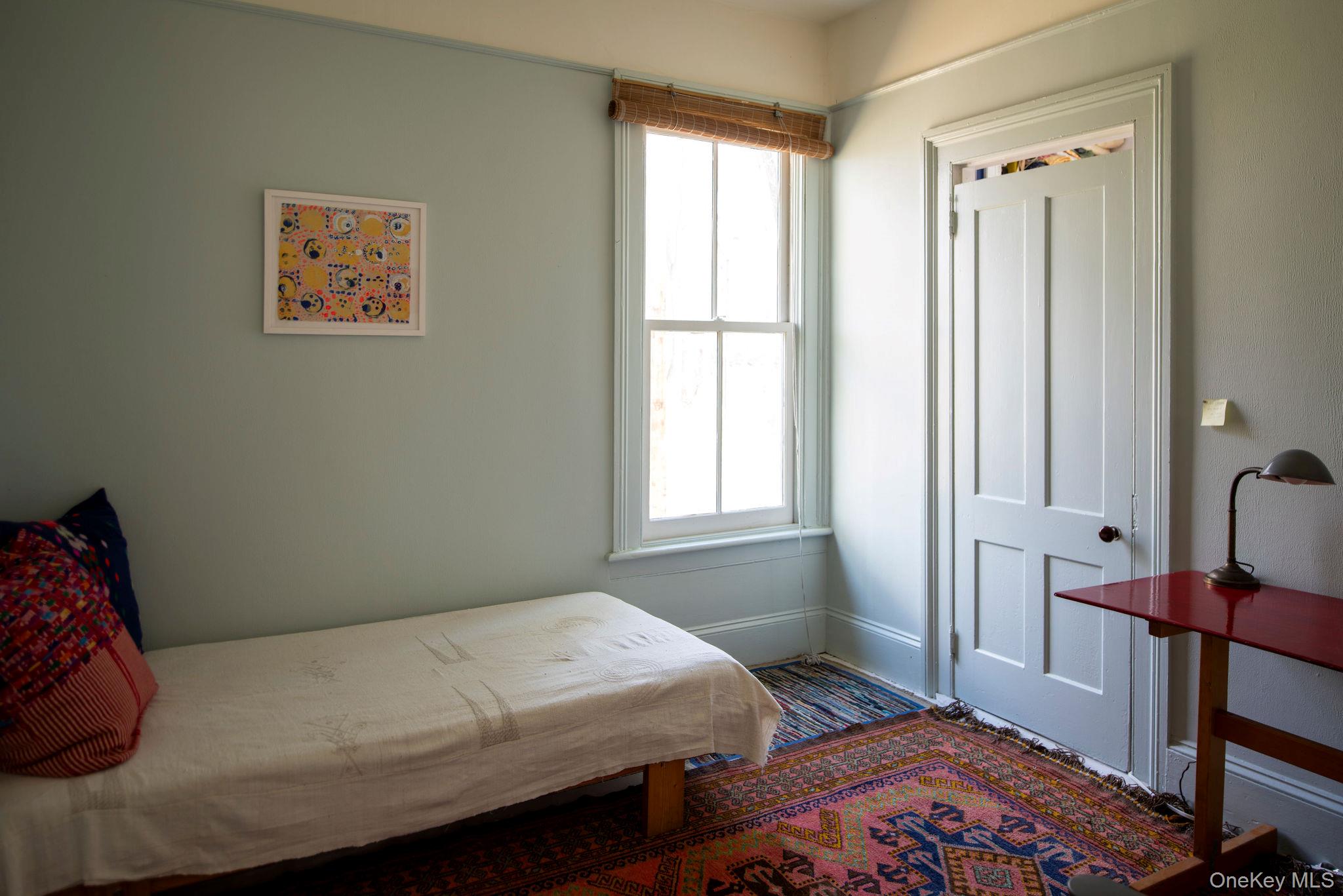 225 Barrytown Road Barrytown, NY 12507 - Photo 19 of 22 a bedroom with a bed and wooden floor