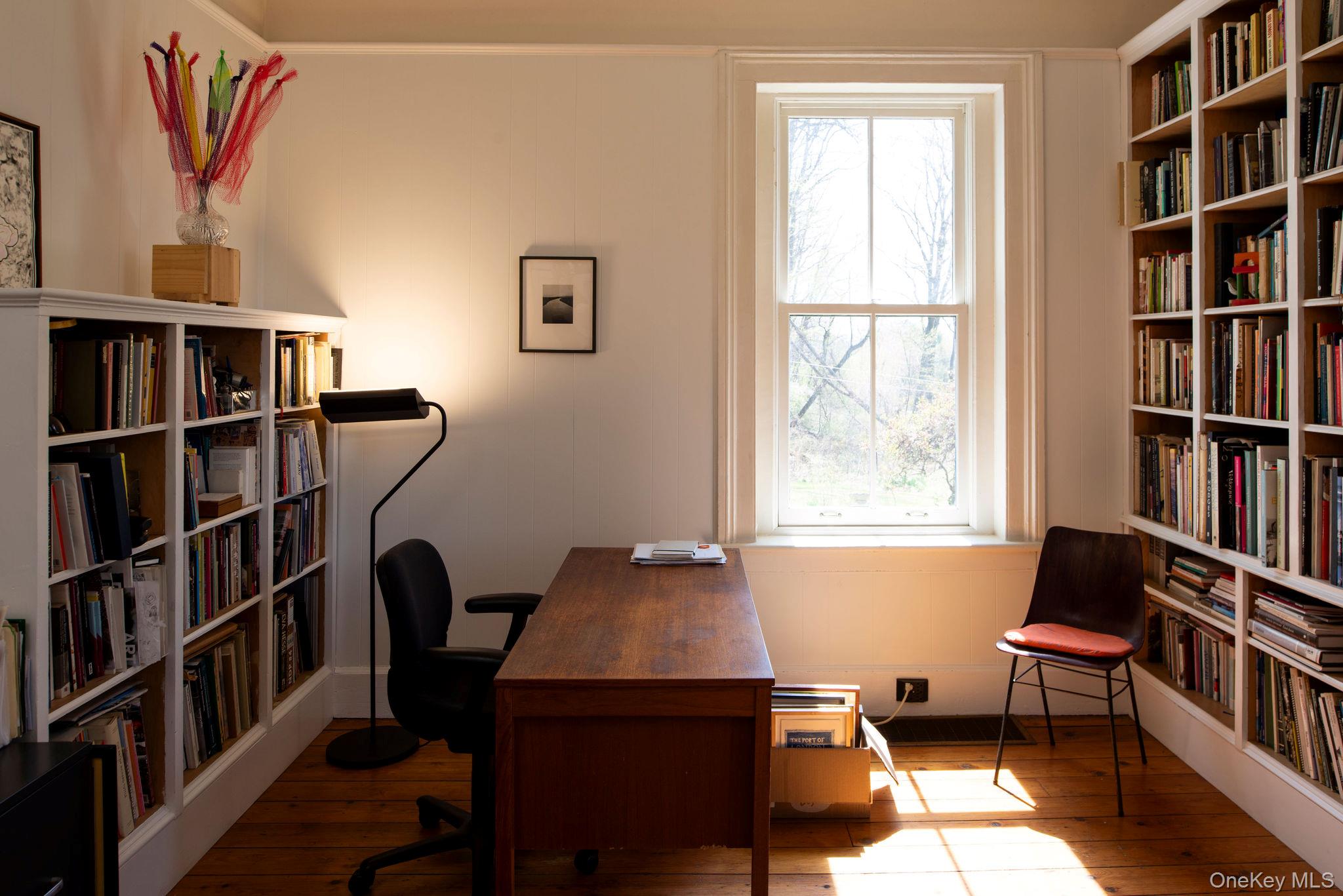 225 Barrytown Road Barrytown, NY 12507 - Photo 7 of 22 a view of a workspace with furniture and a bookshelf