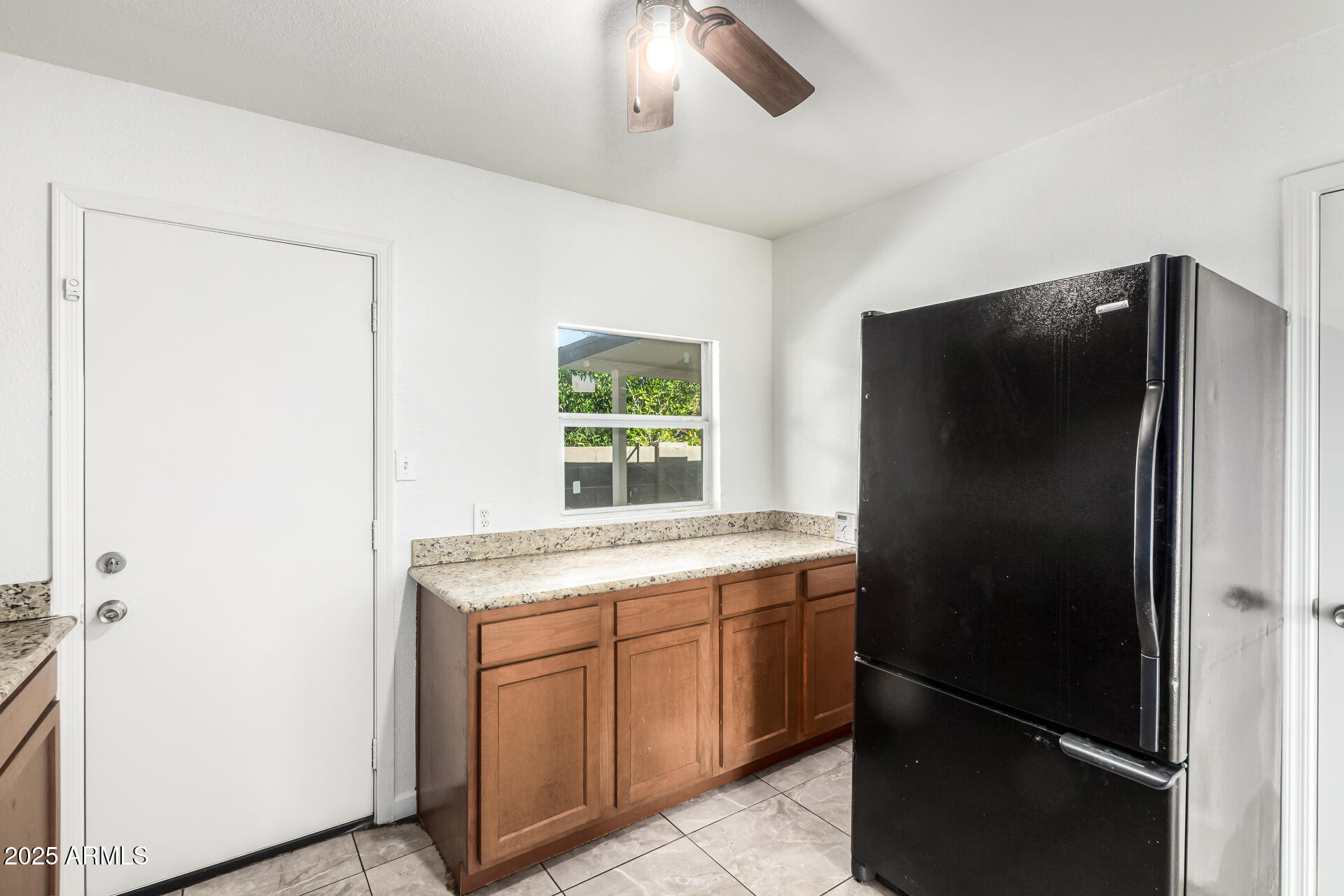 1010 East Chipman Road Phoenix, AZ 85040 - Photo 13 of 23 a kitchen with a refrigerator and a sink