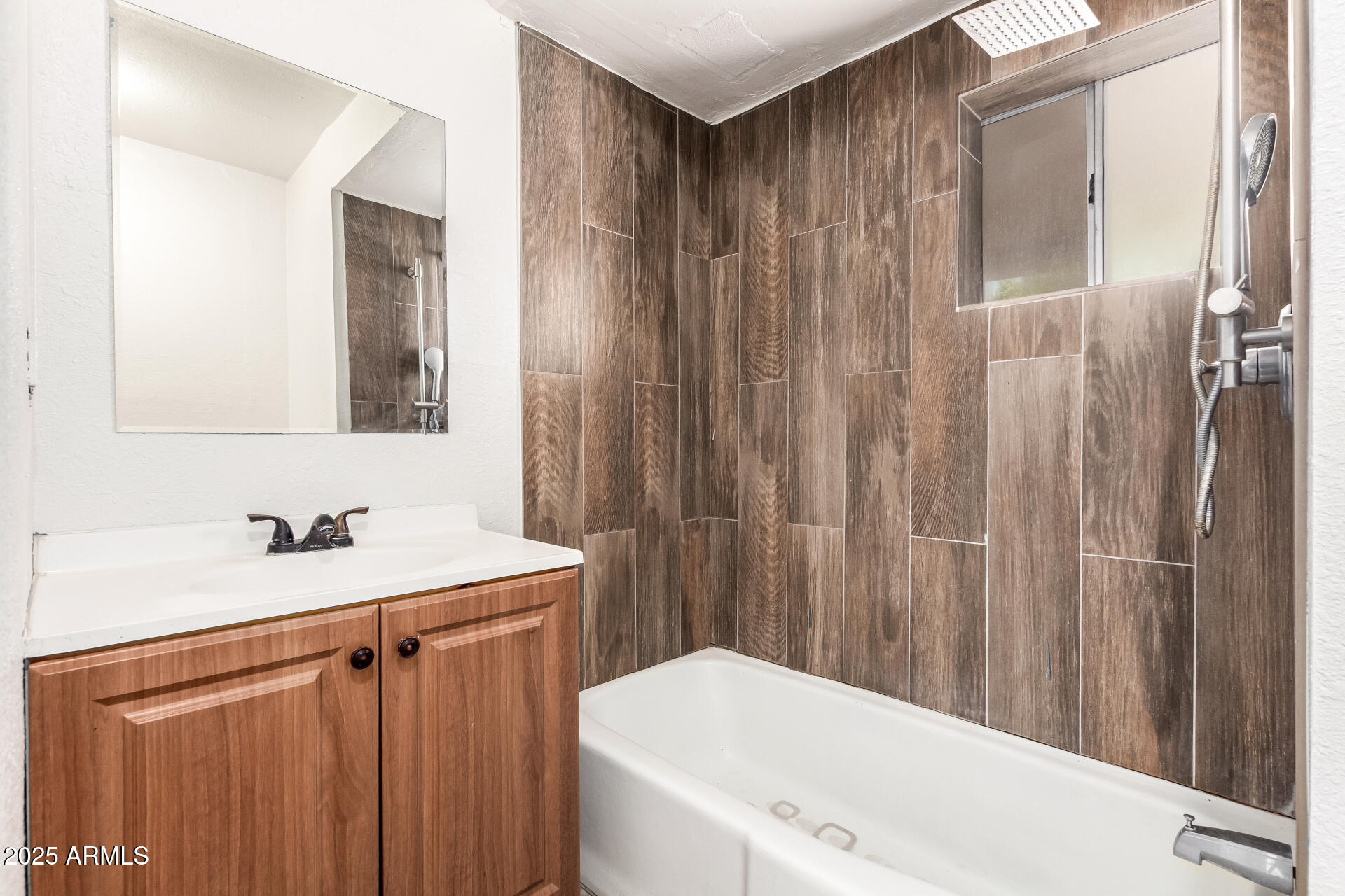 1010 East Chipman Road Phoenix, AZ 85040 - Photo 16 of 23 a bathroom with a sink a toilet and a mirror