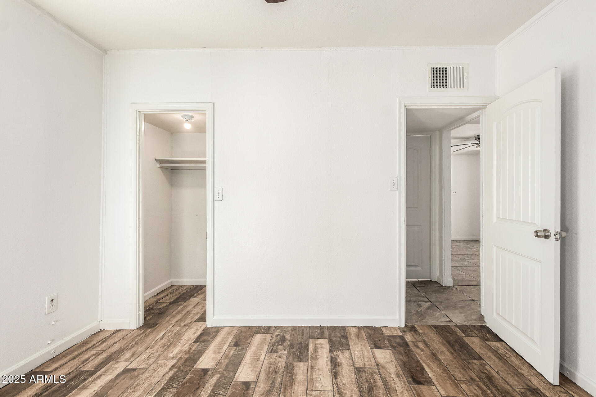 1010 East Chipman Road Phoenix, AZ 85040 - Photo 19 of 23 a view of a room with wooden floor and a bathroom