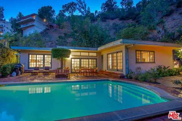 a front view of house with yard and seating area