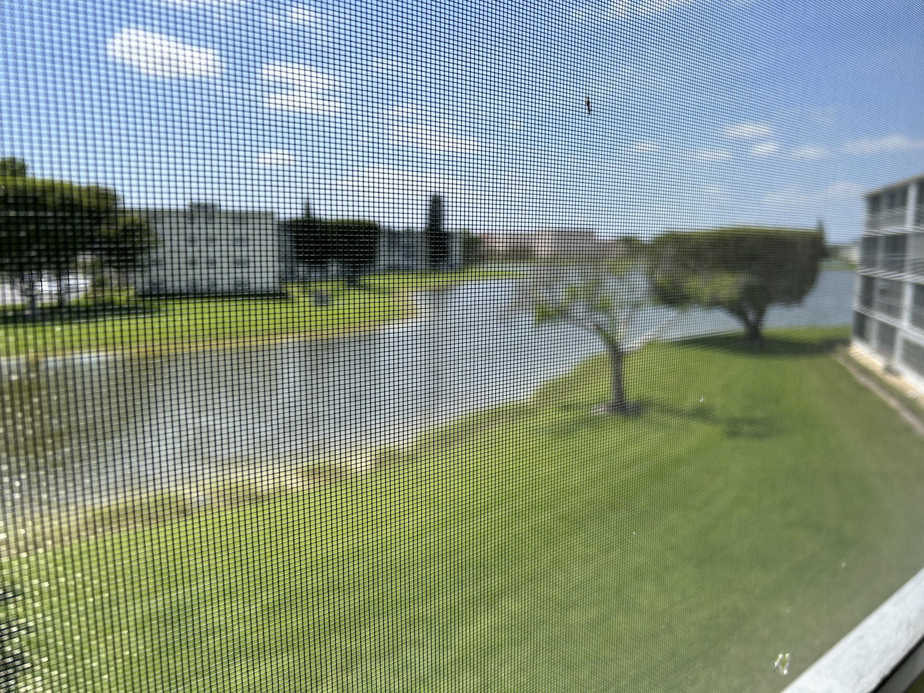 3070 Cornwall East, Unit 3070D Boca Raton, FL 33434 - Photo 14 of 22 a view of a swimming pool with seating area and covered with water fall