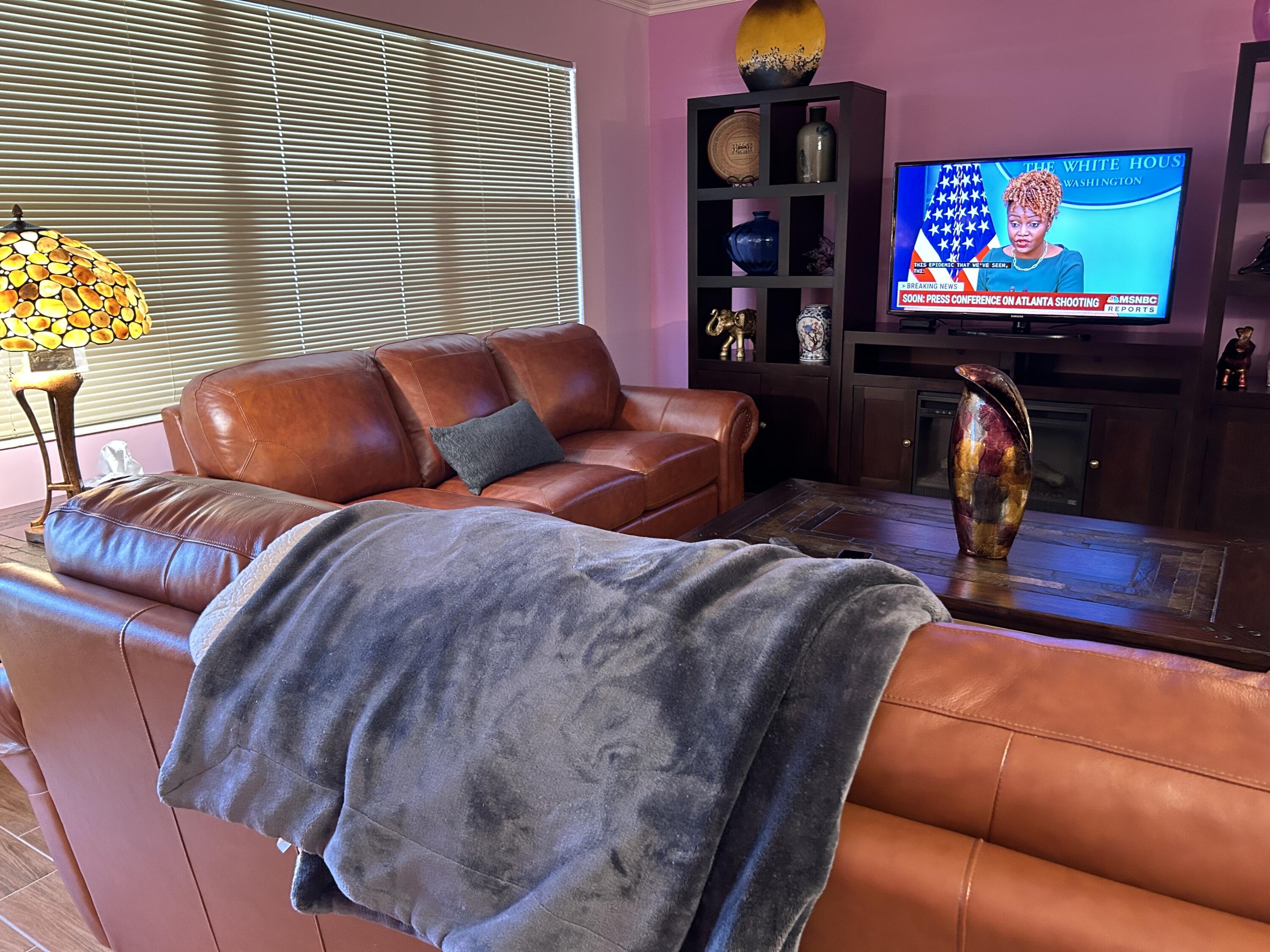 3070 Cornwall East, Unit 3070D Boca Raton, FL 33434 - Photo 16 of 22 a living room with furniture and a flat screen tv
