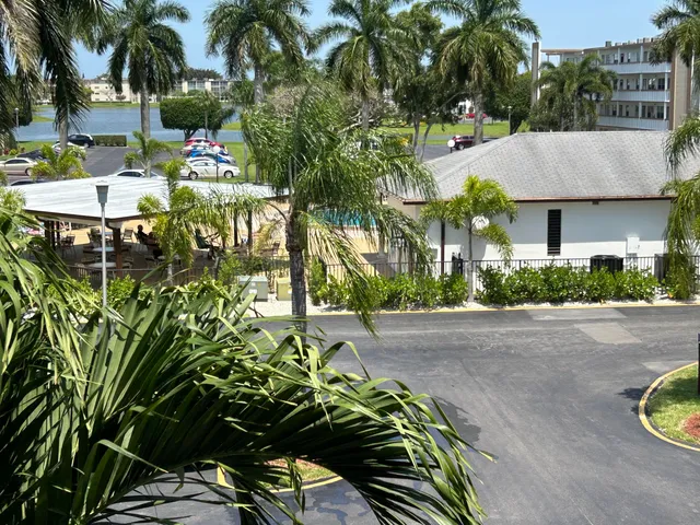 a view of a patio with table and chairs and potted plants