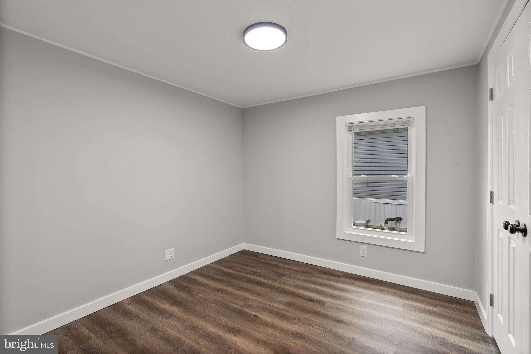 635 Sunset Strip Brooklyn, MD 21225 - Photo 13 of 27 an empty room with a window