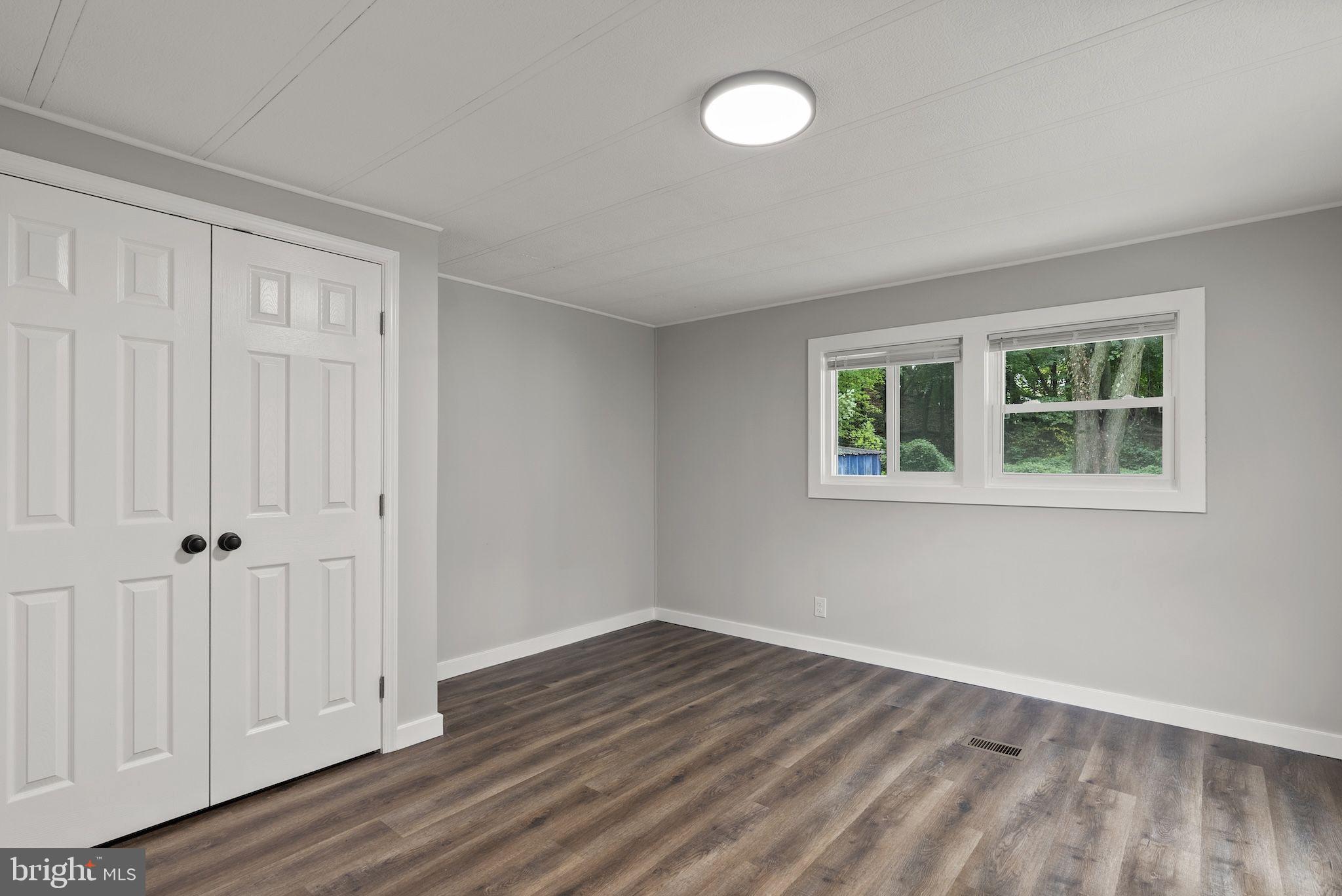 635 Sunset Strip Brooklyn, MD 21225 - Photo 19 of 27 wooden floor in an empty room