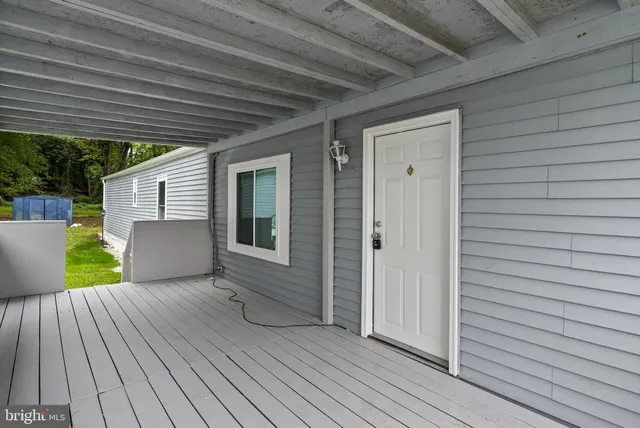 a view of a backyard with wooden floor