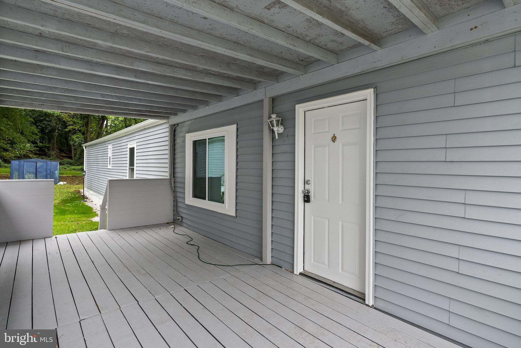 635 Sunset Strip Brooklyn, MD 21225 - Photo 21 of 27 a view of a backyard with wooden floor