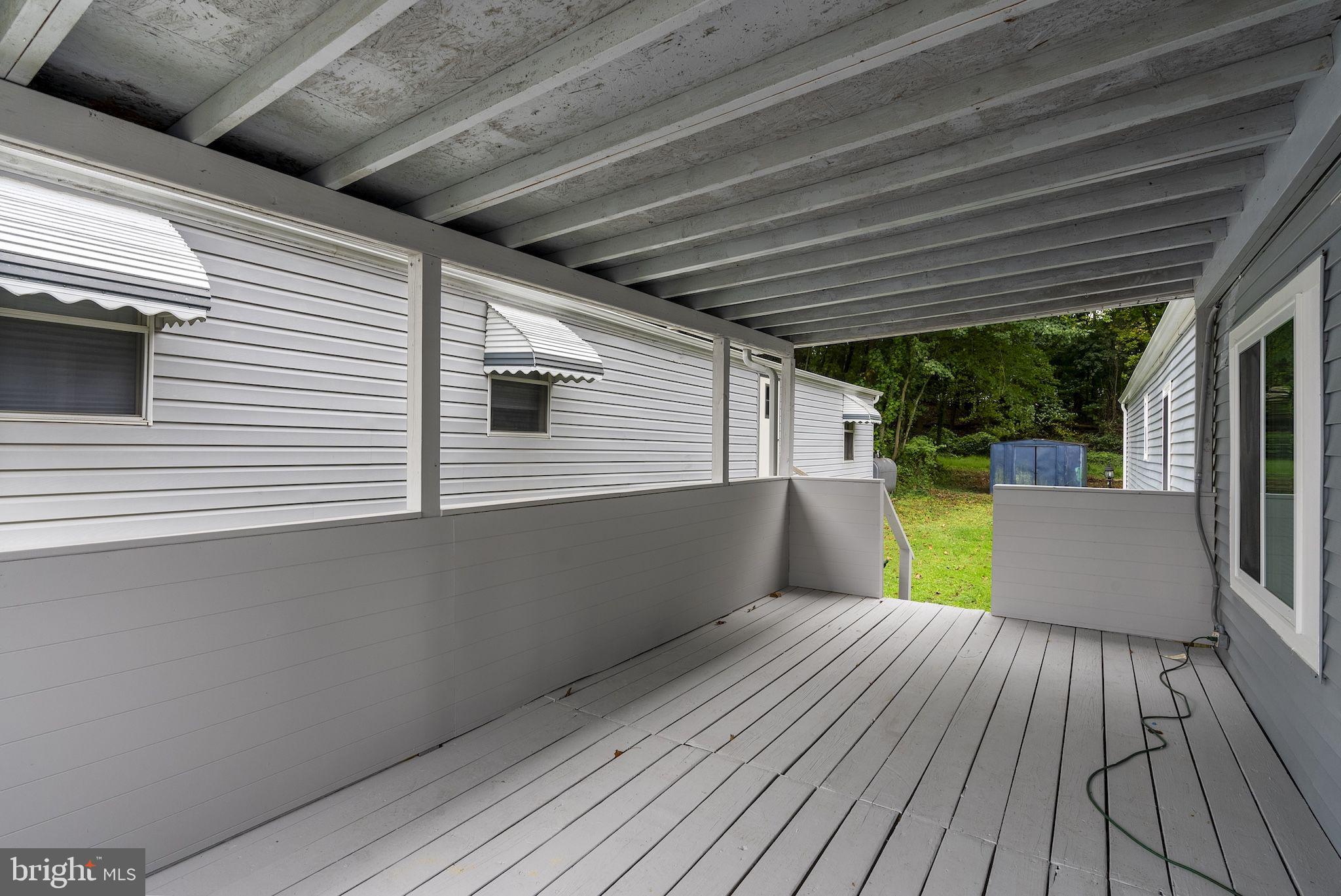 635 Sunset Strip Brooklyn, MD 21225 - Photo 22 of 27 a view of a patio with wooden floor