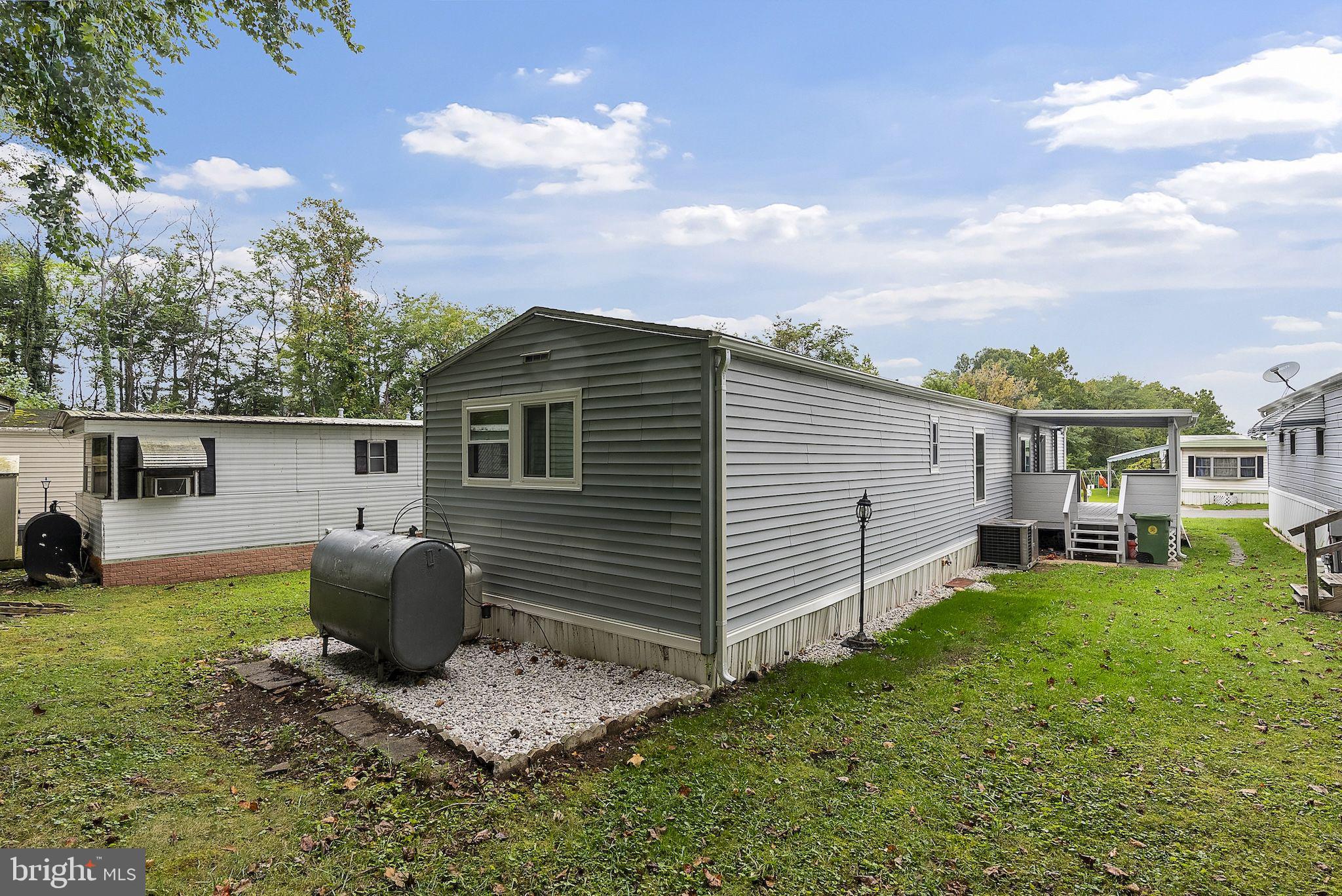 635 Sunset Strip Brooklyn, MD 21225 - Photo 26 of 27 a view of a house with a yard