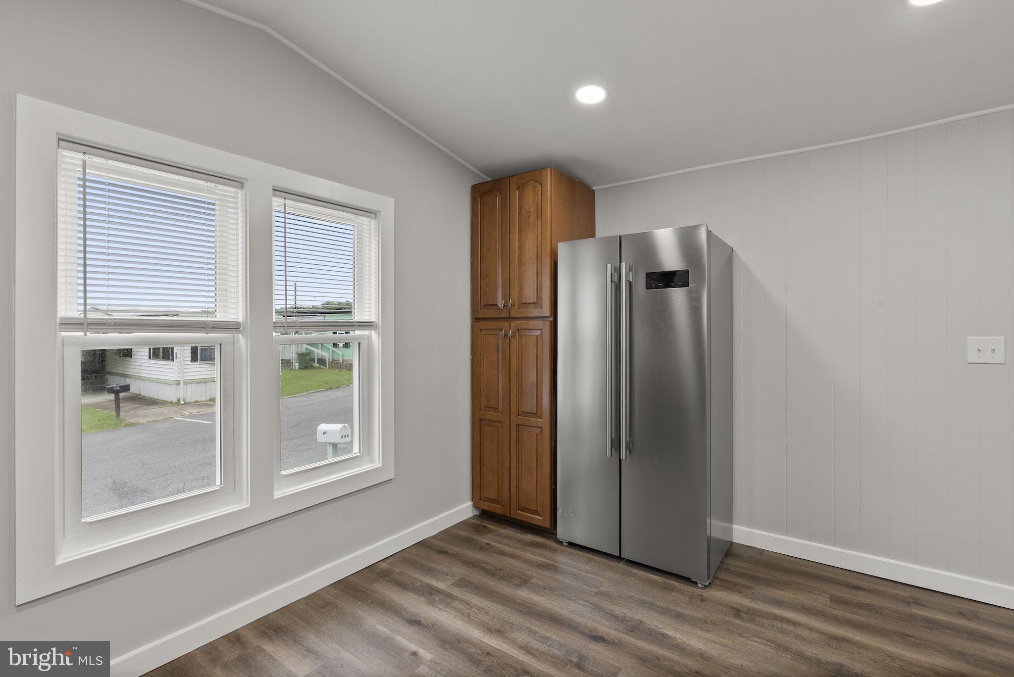 635 Sunset Strip Brooklyn, MD 21225 - Photo 5 of 27 an empty room with windows and closet