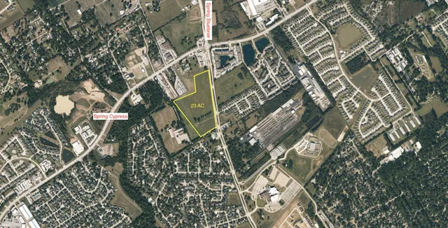 a view of a lake with houses in the back