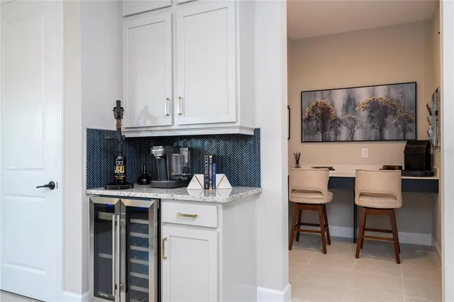 a view of kitchen with dining area and glass door