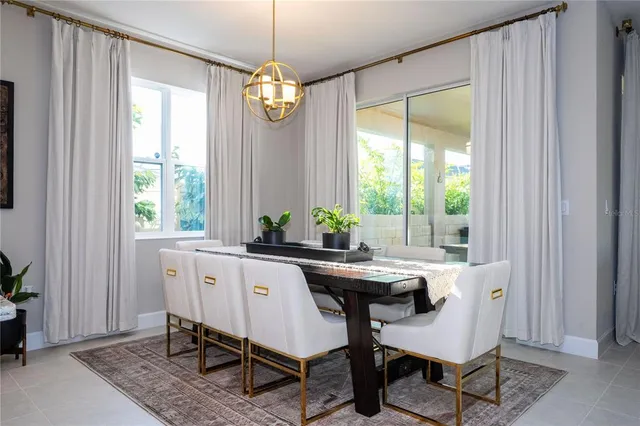 a bathroom with a bathtub a double vanity sink and mirror