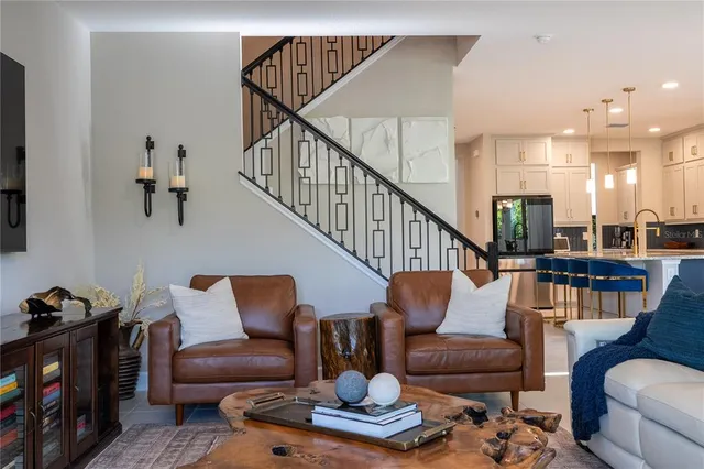 a view of a livingroom with furniture and windows