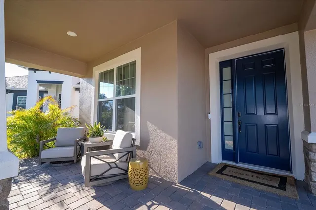 a view of hallway with livingroom and furniture
