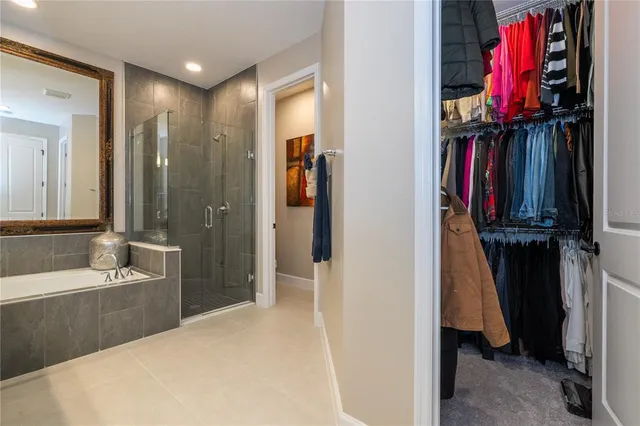 a view of a house with swimming pool and chairs