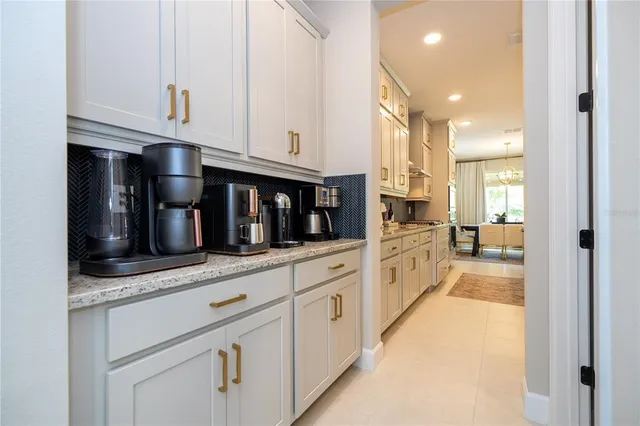 a kitchen with stainless steel appliances kitchen island granite countertop lots of counter top space