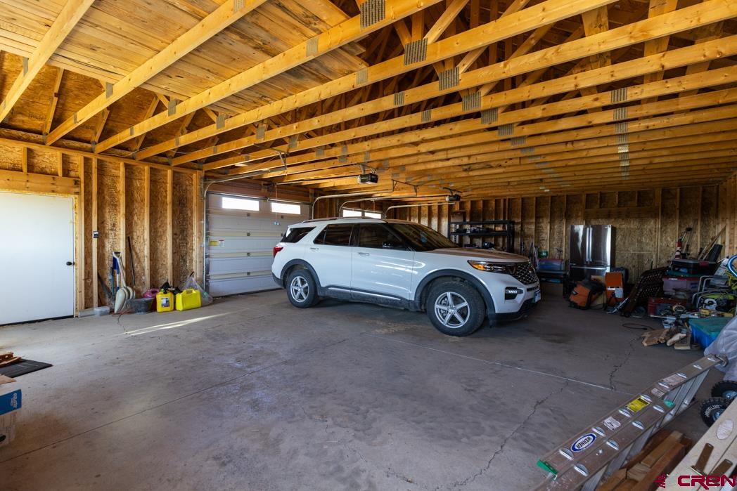 1737 Roberts Ridge Drive Hesperus, CO 81326 - Photo 25 of 34 a view of a garage with parked cars
