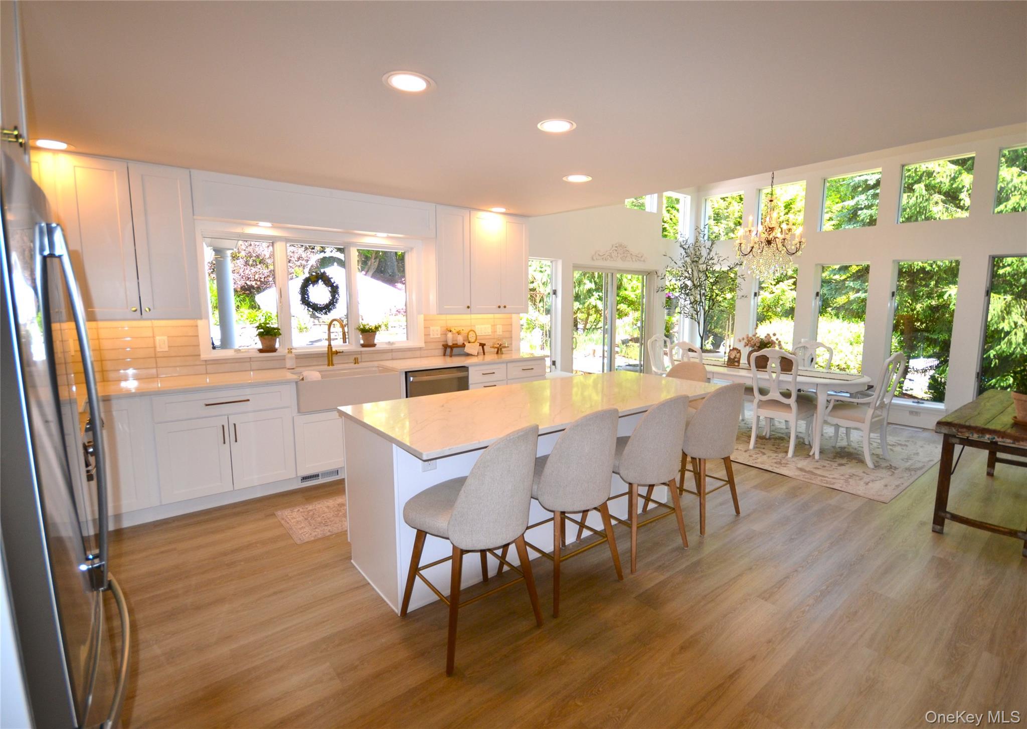 266 Shear Hill Road Mahopac, NY 10541 - Photo 2 of 34 a dining room with furniture large windows and wooden floor