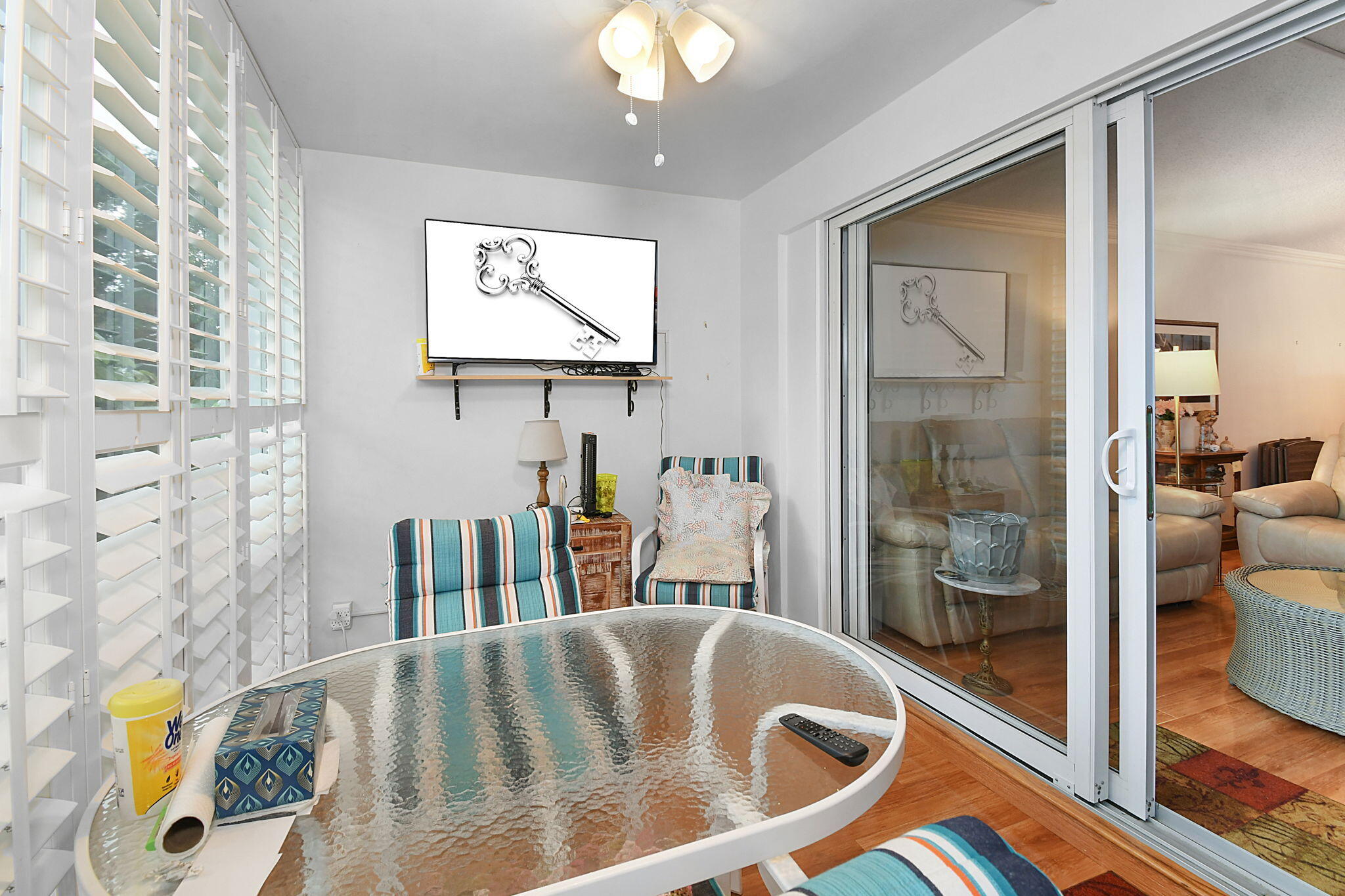 400 Northeast 20th Street, Unit A207 Boca Raton, FL 33431 - Photo 15 of 55 a very nice looking room with a large window and chandelier