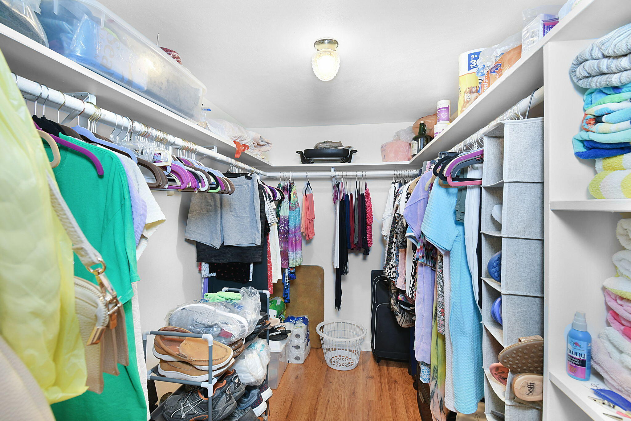 400 Northeast 20th Street, Unit A207 Boca Raton, FL 33431 - Photo 20 of 55 a view of walk in closet with clothes and shoes