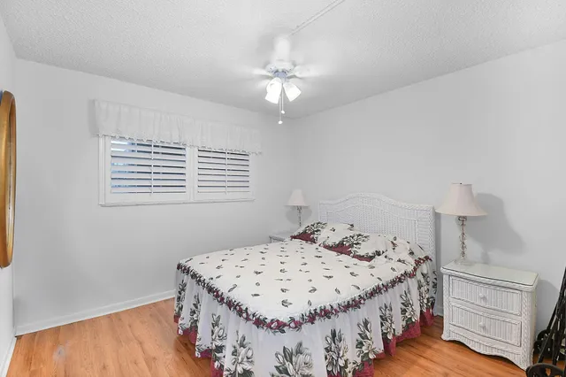 a bedroom with a bed and a table in it