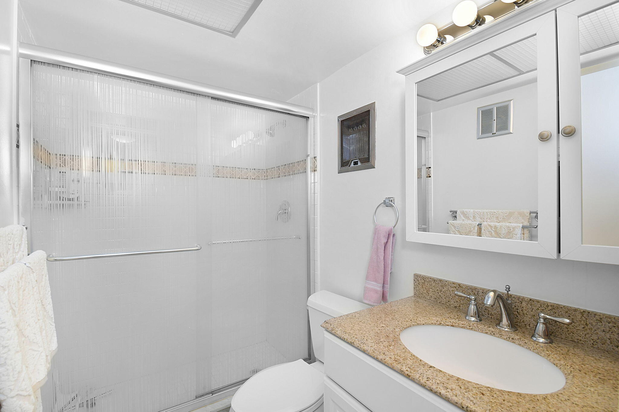 400 Northeast 20th Street, Unit A207 Boca Raton, FL 33431 - Photo 24 of 55 a bathroom with a granite countertop sink toilet and shower