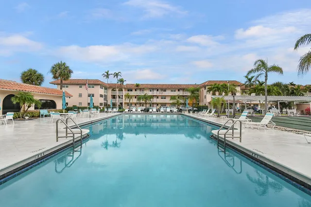 a view of a swimming pool with a deck