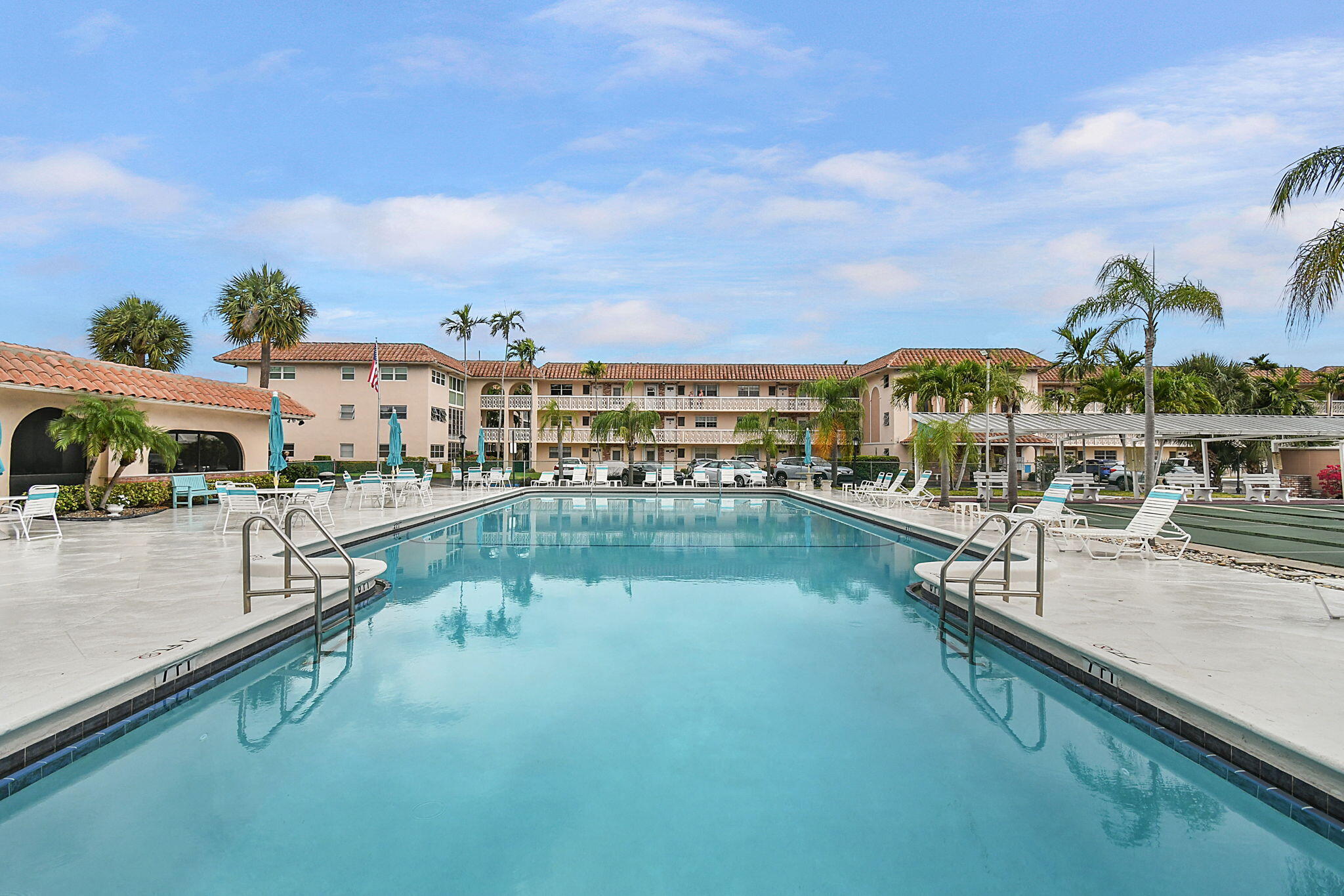 400 Northeast 20th Street, Unit A207 Boca Raton, FL 33431 - Photo 28 of 55 a view of swimming pool with outdoor seating