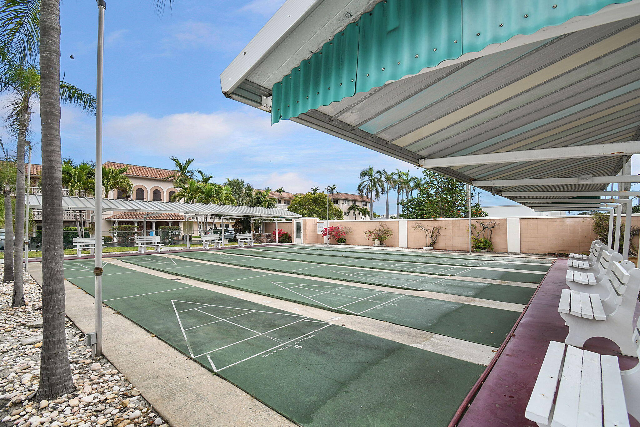 400 Northeast 20th Street, Unit A207 Boca Raton, FL 33431 - Photo 31 of 55 a view of a swimming pool with a deck