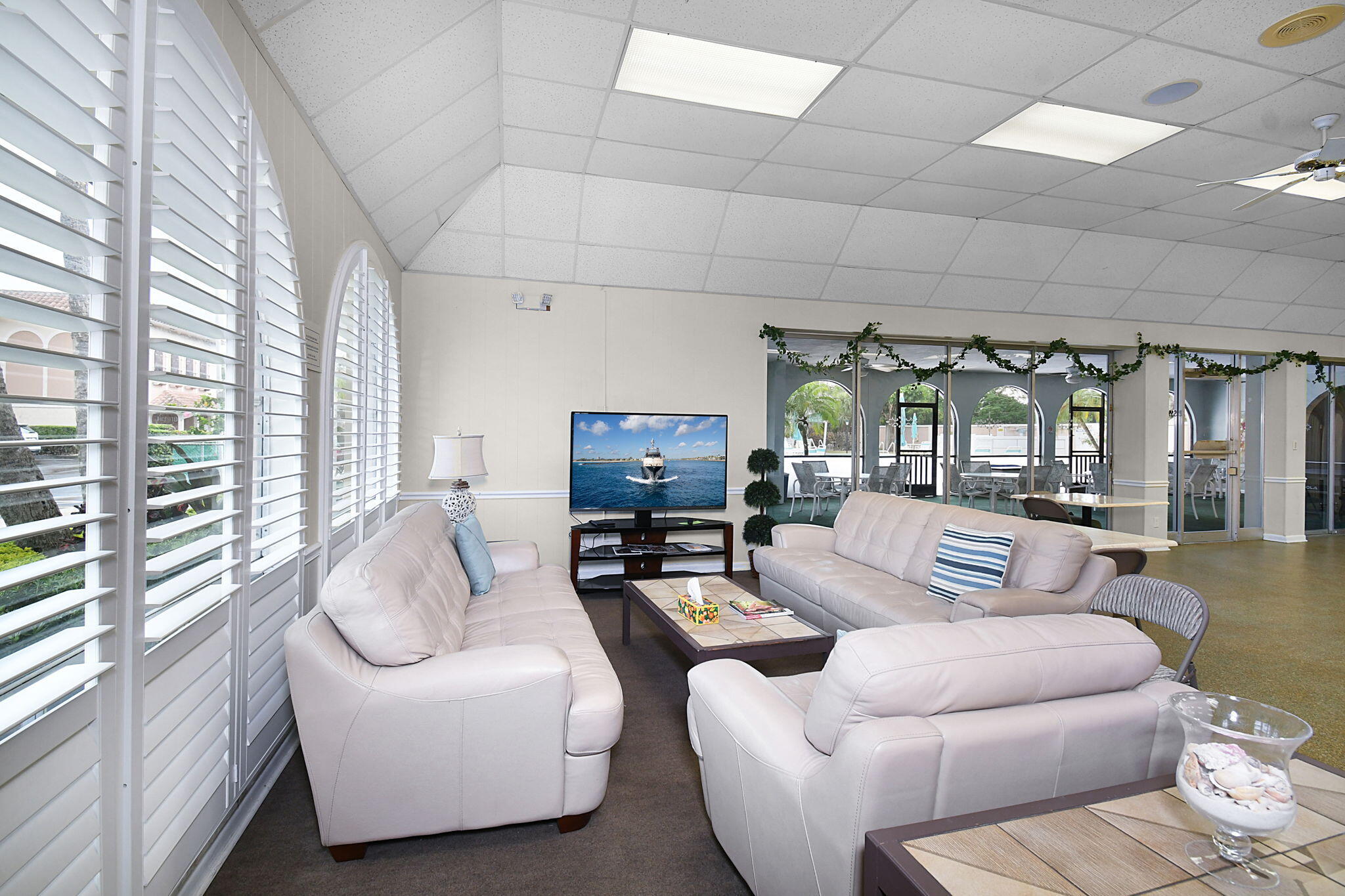 400 Northeast 20th Street, Unit A207 Boca Raton, FL 33431 - Photo 34 of 55 a living room with furniture and a large window