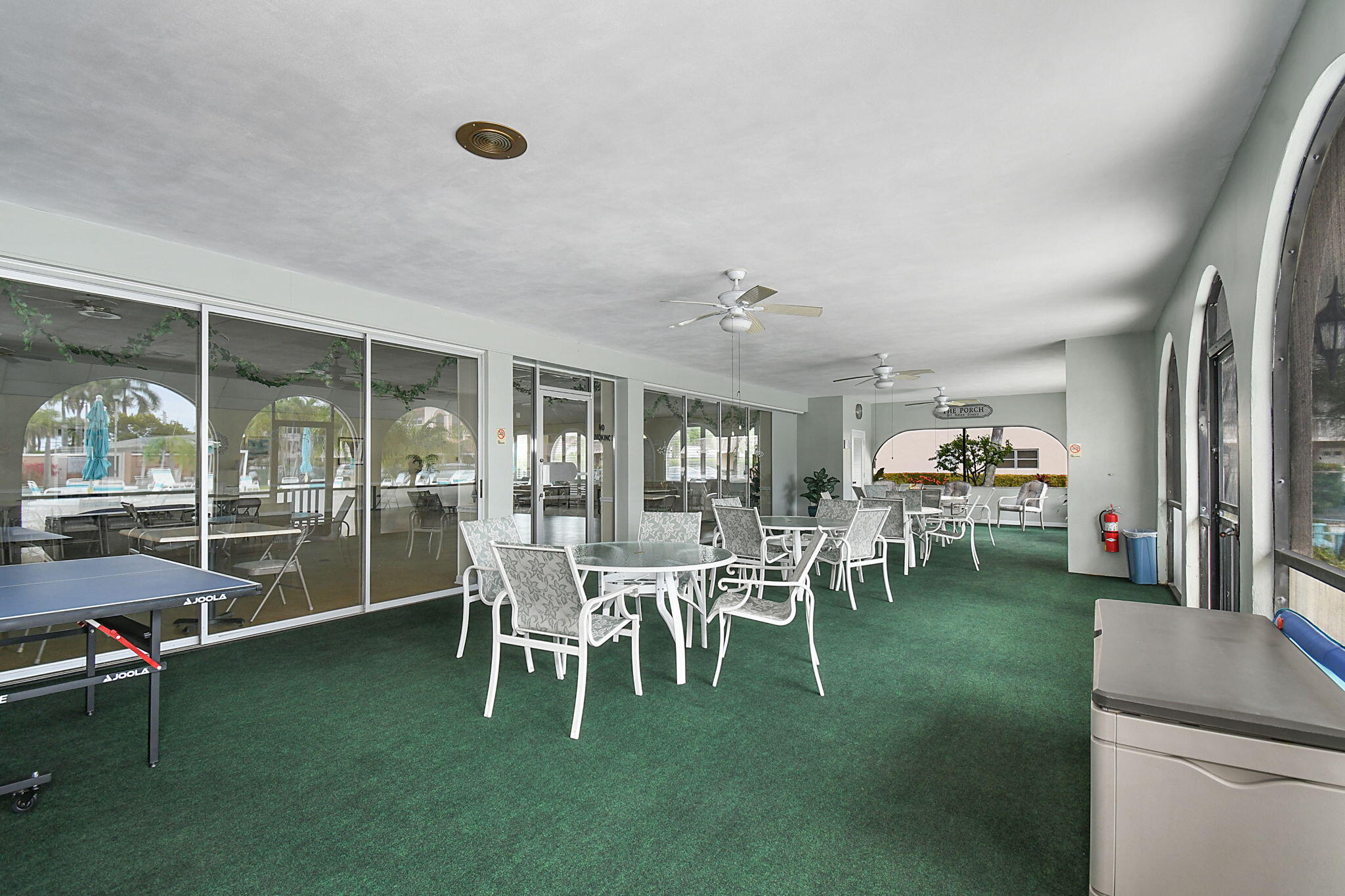 400 Northeast 20th Street, Unit A207 Boca Raton, FL 33431 - Photo 36 of 55 a dining room with furniture and a floor to ceiling window