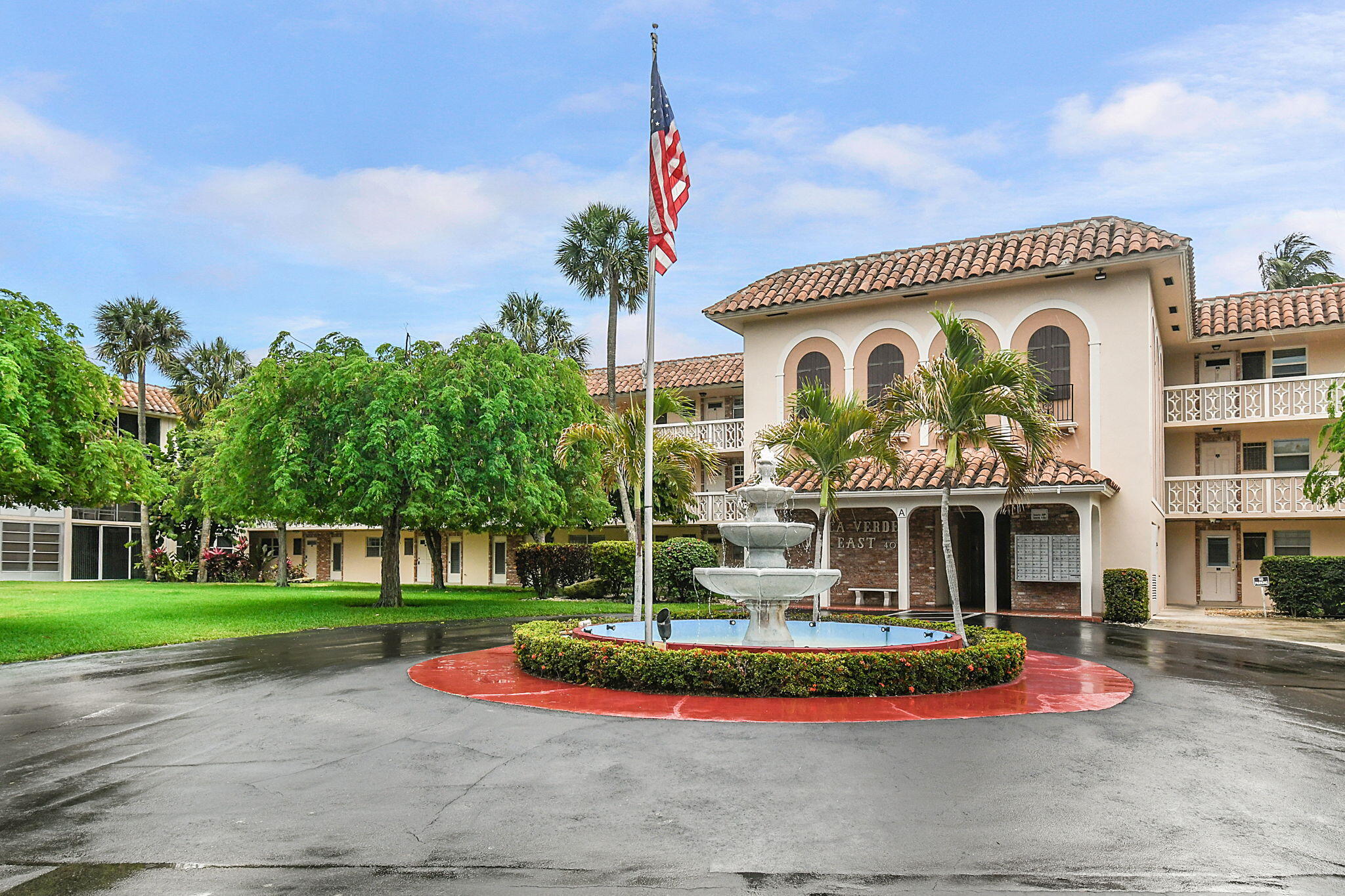 400 Northeast 20th Street, Unit A207 Boca Raton, FL 33431 - Photo 38 of 55 a front view of a house with a yard