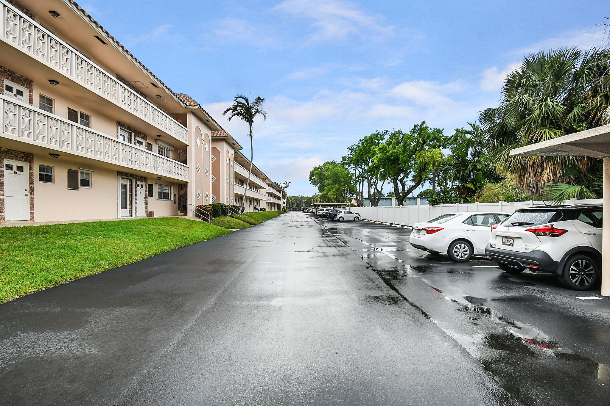 400 Northeast 20th Street, Unit A207 Boca Raton, FL 33431 - Photo 39 of 55 a view of street with parked cars