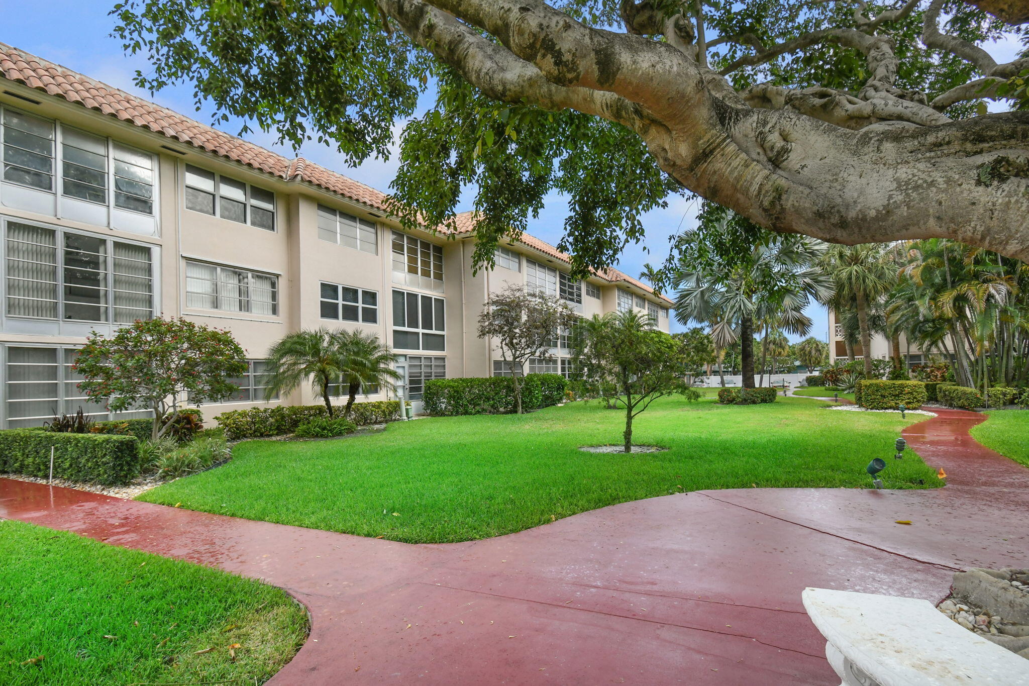 400 Northeast 20th Street, Unit A207 Boca Raton, FL 33431 - Photo 49 of 55 a view of a house with a garden